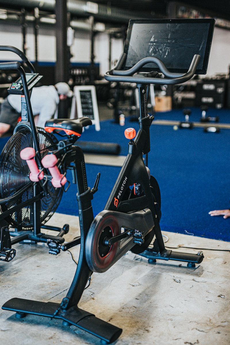 black and blue peloton on gray concrete floor