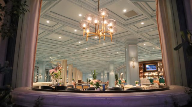 a room at the venetian resort las vegas with a table and chairs