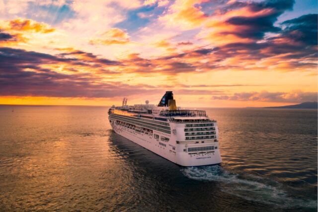 Norwegian cruise ship under cloudy sky