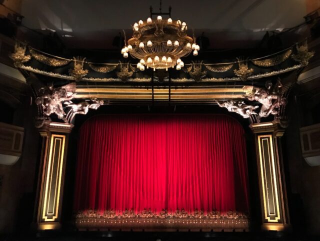 red curtain broadway stage