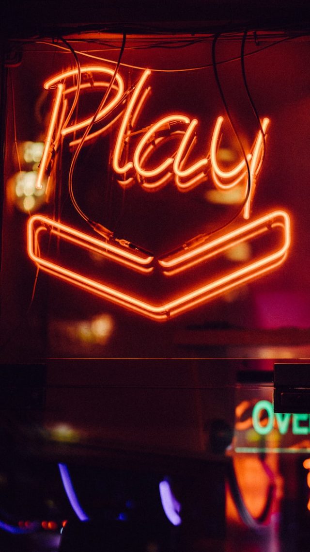 red Play neon light signage from gamestop