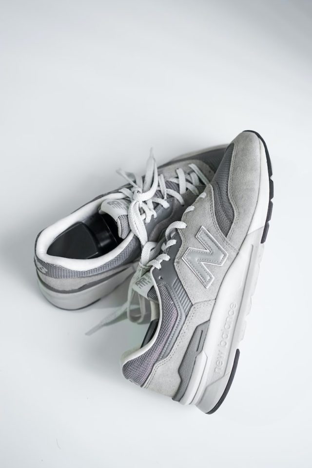 gray and white new balance athletic shoe